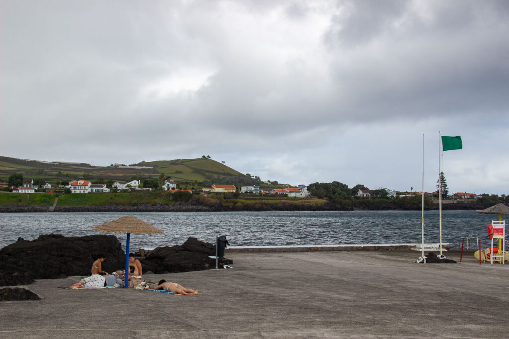 Local Portuguese sunbathers lying on a concrete “beach” on Terceira, in the Azores. ©KettiWilhelm2024