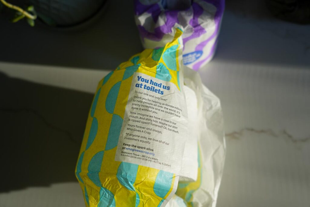 Who Gives A Crap toilet roll packaging with "you had us at toilets" written on the plastic-free packaging, advertising their charity work donating 50% of profits to sanitation projects. ©KettiWilhelm2024