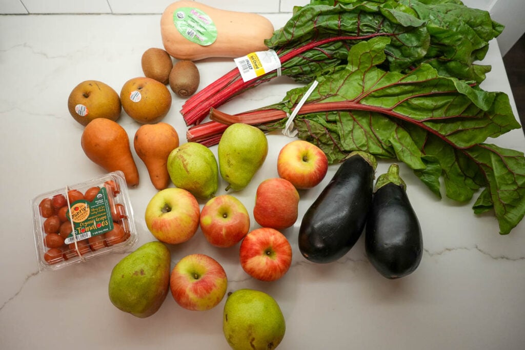 My organic produce delivery in my latest order from Misfits Market: Swiss chard, butternut squash, eggplants, pears, apples, Asian pear, kiwis, and cherry tomatoes. ©KettiWilhelm2024
