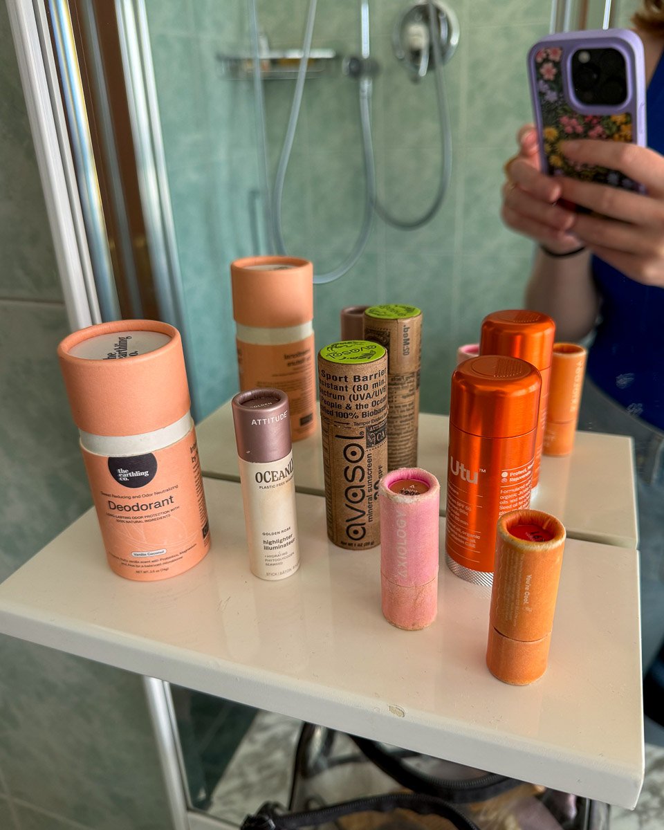 My collection of organic sunscreen sticks (from Avasol and Utu) and other beauty products packaged in plastic-free tubes. ©KettiWilhelm2025