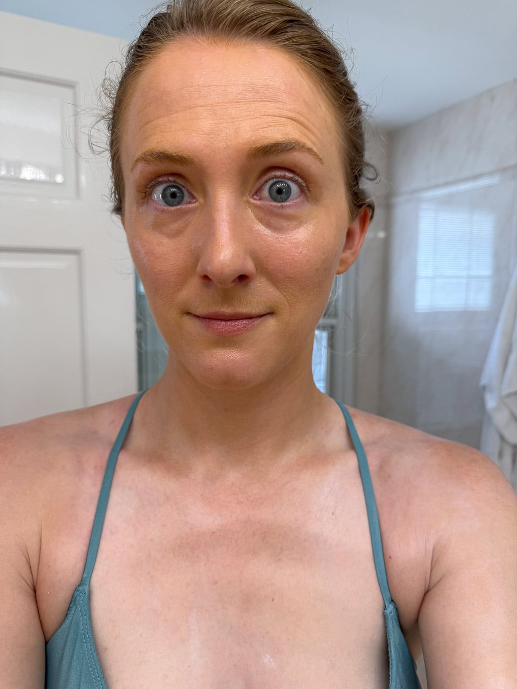 Selfie of the author with All Good's tinted SPF 50 mineral sunscreen on her face, showing that the warm medium shade is a bit too dark for fair skin, but perfect for olive skin. ©KettiWilhelm2026
