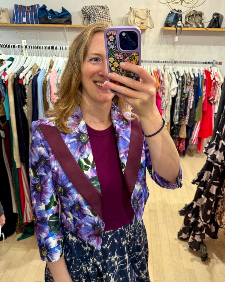 Trying on a used Dolce and Gabbana blazer in a consignment store in Boston. ©KettiWilhelm2025