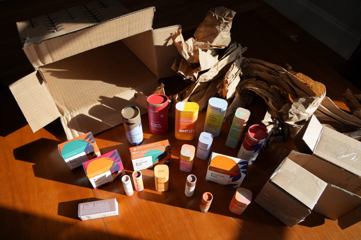 Unboxing plastic-free skincare and other products from ATTITUDE Living, including mineral sunscreens, all shipped in cardboard shipping and packaging materials. ©KettiWilhelm2026