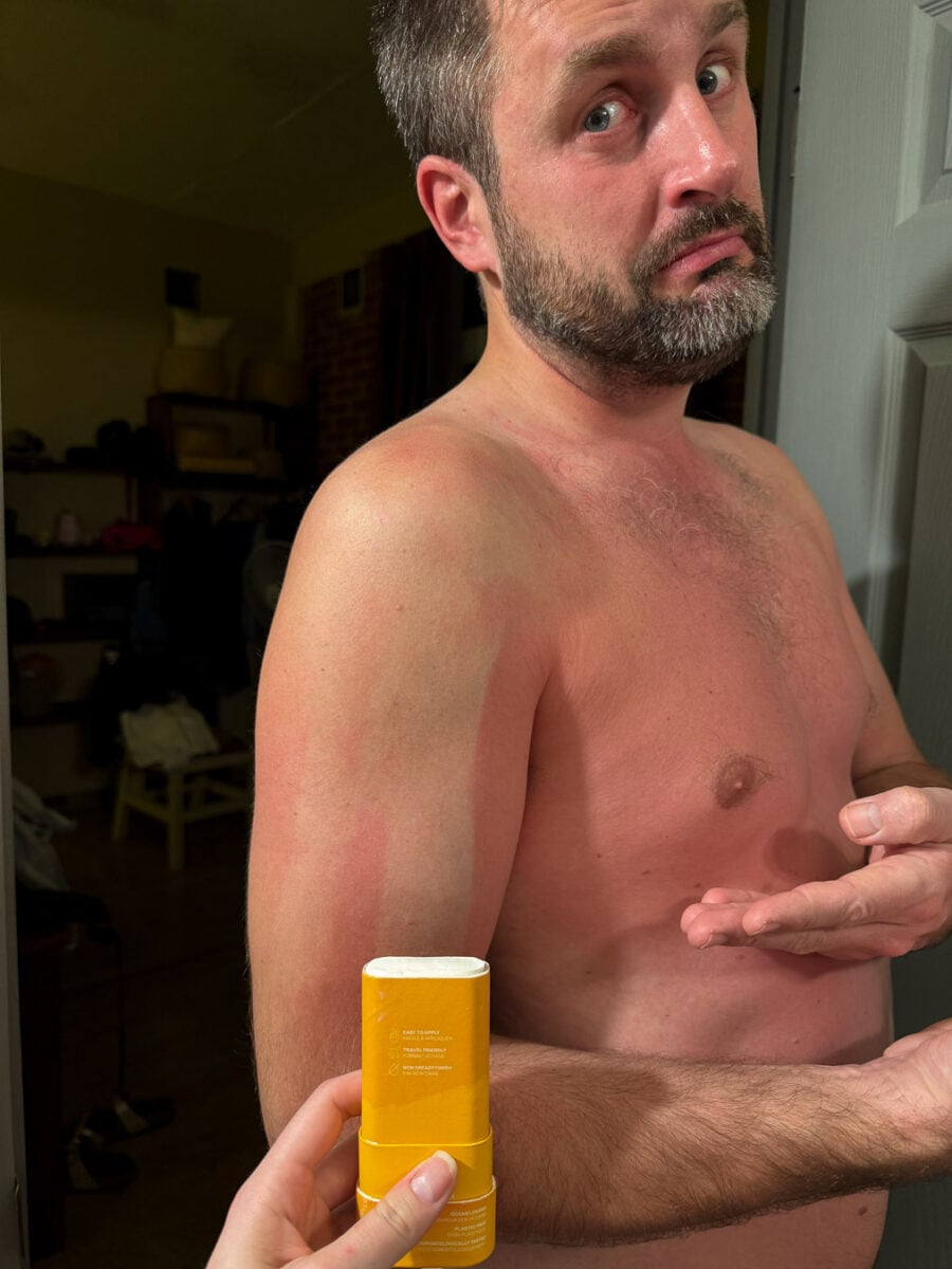 The review writer's husband, a white man in his 40s, with a streak of unburnt skin where he applied ATTITUDE plastic-free mineral sunscreen, and a sunburn where he didn't spread it. ©KettiWilhelm2026
