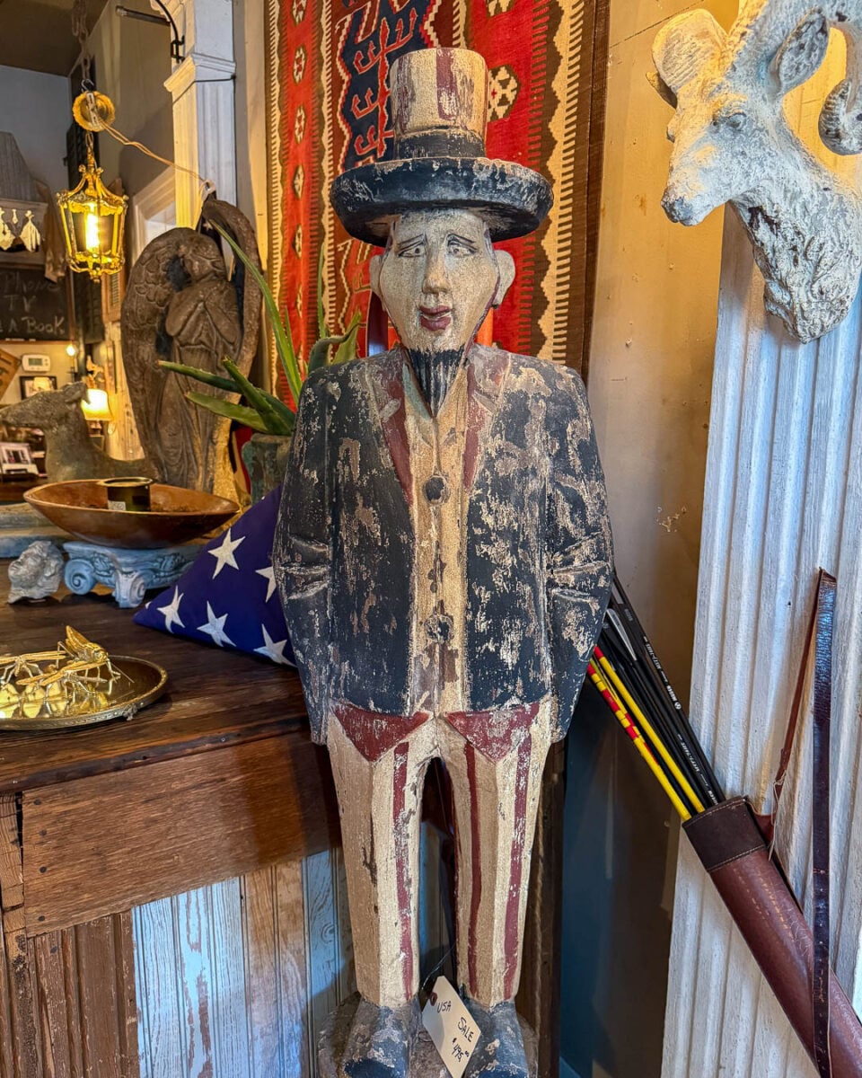 A vintage Americana statue of a man dressed in red, white and blue at the T. Nesbitt & Co. antique store in downtown Franklin, Tennessee. ©KettiWilhelm2026