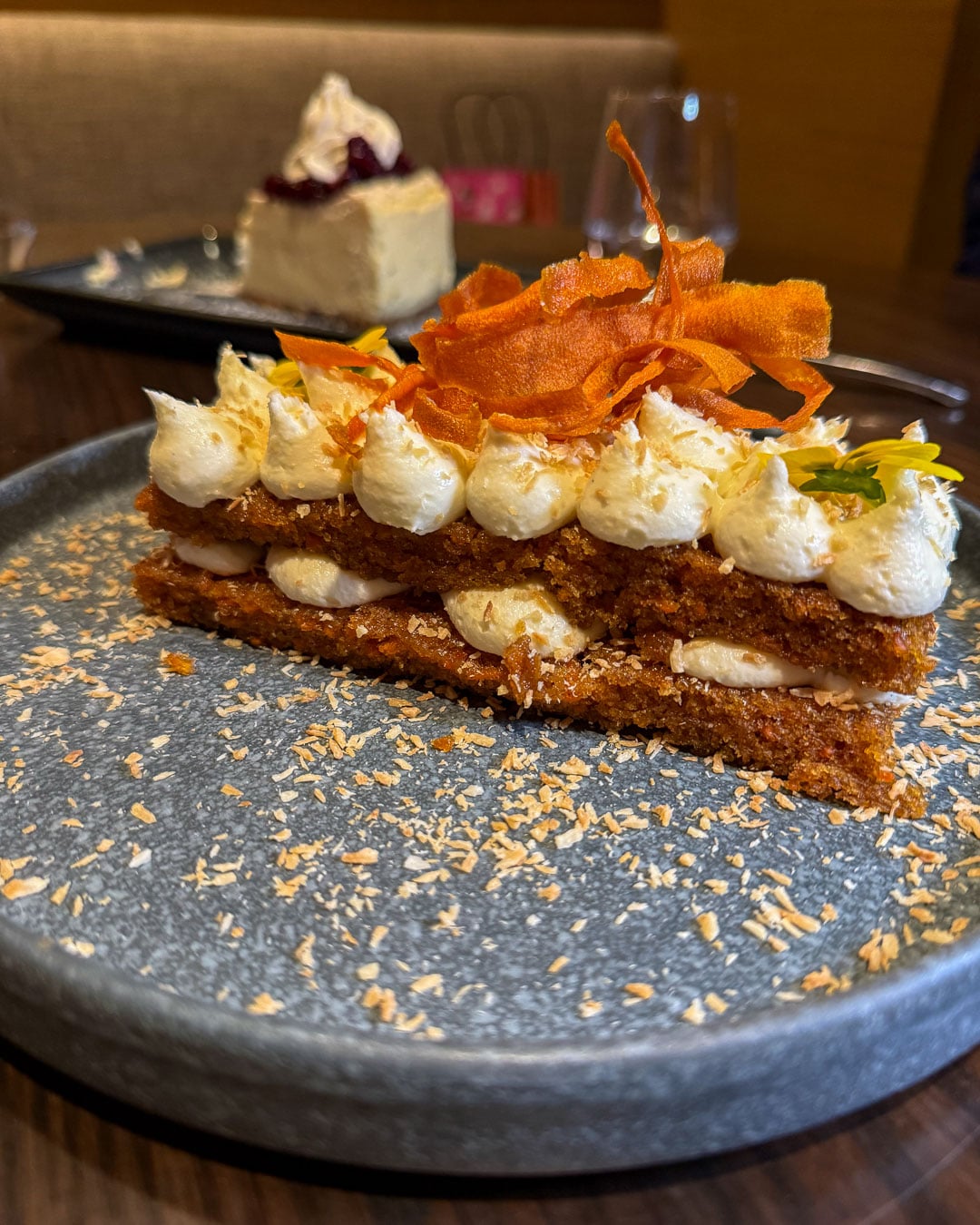 A decadent piece of carrot cake at the 1799 Restaurant, inside the Harpeth Hotel, a locally owned hotel that's part of Hilton's Curio Collection, in downtown Franklin, Tennessee. ©KettiWilhelm2026