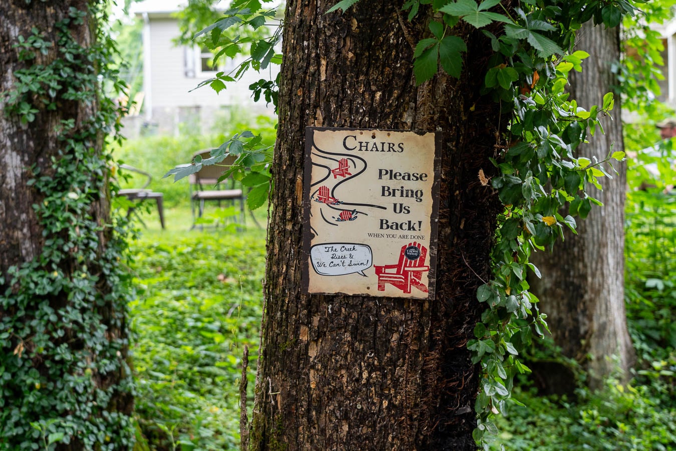 Sign at Crown Winery Leiper's Fork asking patrons to remove chairs from the creek when they're finished using them. ©KettiWilhelm2026